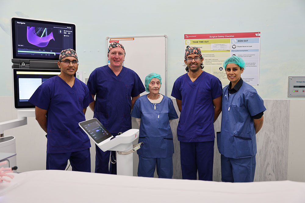 From left to right, Professor Rajesh Thomas, Minister Stephen Dawson, Sandra Ditmanis, Dr Dhaval Thakker, Sir Charles Charles Gairdner Osborne Park Health Care Group Acting Executive Director Renee de Prazer standing together in an operating theatre in Sir Charles Gairdner Hospital with the new bronchoscopy robot. 
